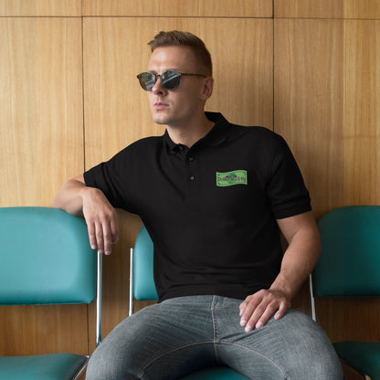 Black Port Authority polo with embroidered Dollar Hustle logo